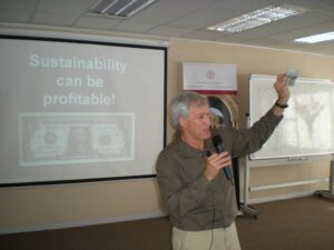 Terry Gips giving a presentation titled "Sustainability can be profitable!"
