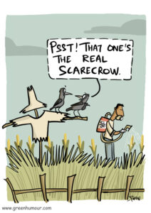 Comic: Two crows perch on the arm of a scarecrow while they look at a man spraying pesticides on a field of corn. One of the crows points to the man and says "Psst! That one's the real scarecrow."