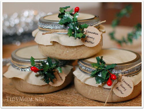 Three small jars with mistletoe decorations, labeled as "Cinnamon Honey Butter."
